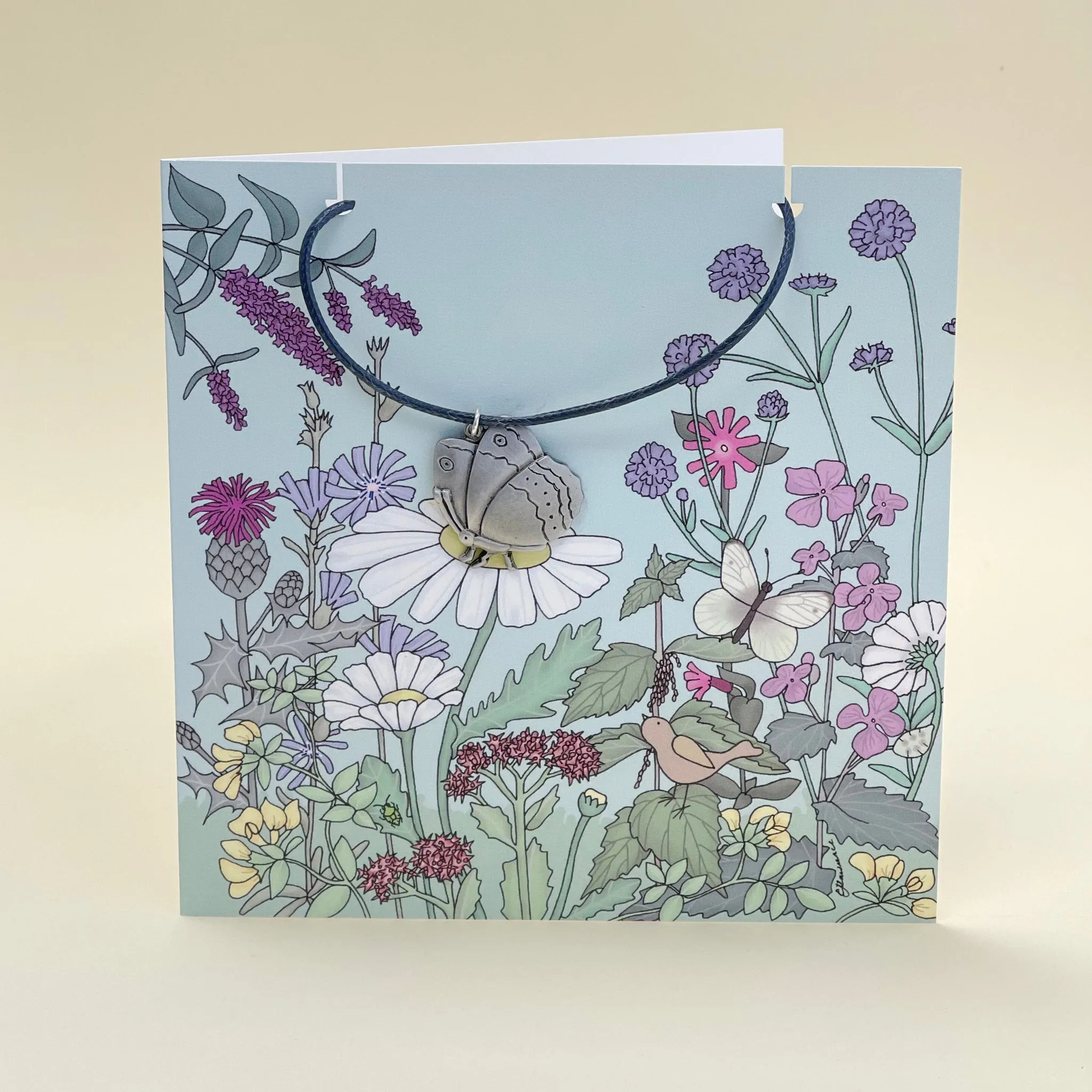 Card with butterfly necklace